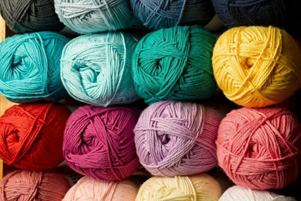 Balls of yarn in many colors stacked on top of each other